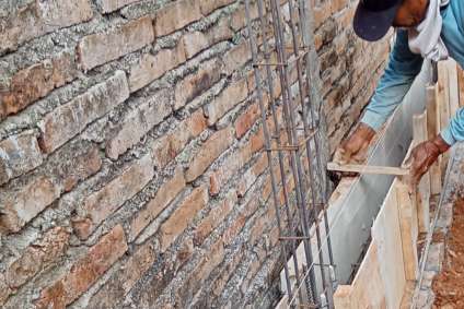 man building retaining wall