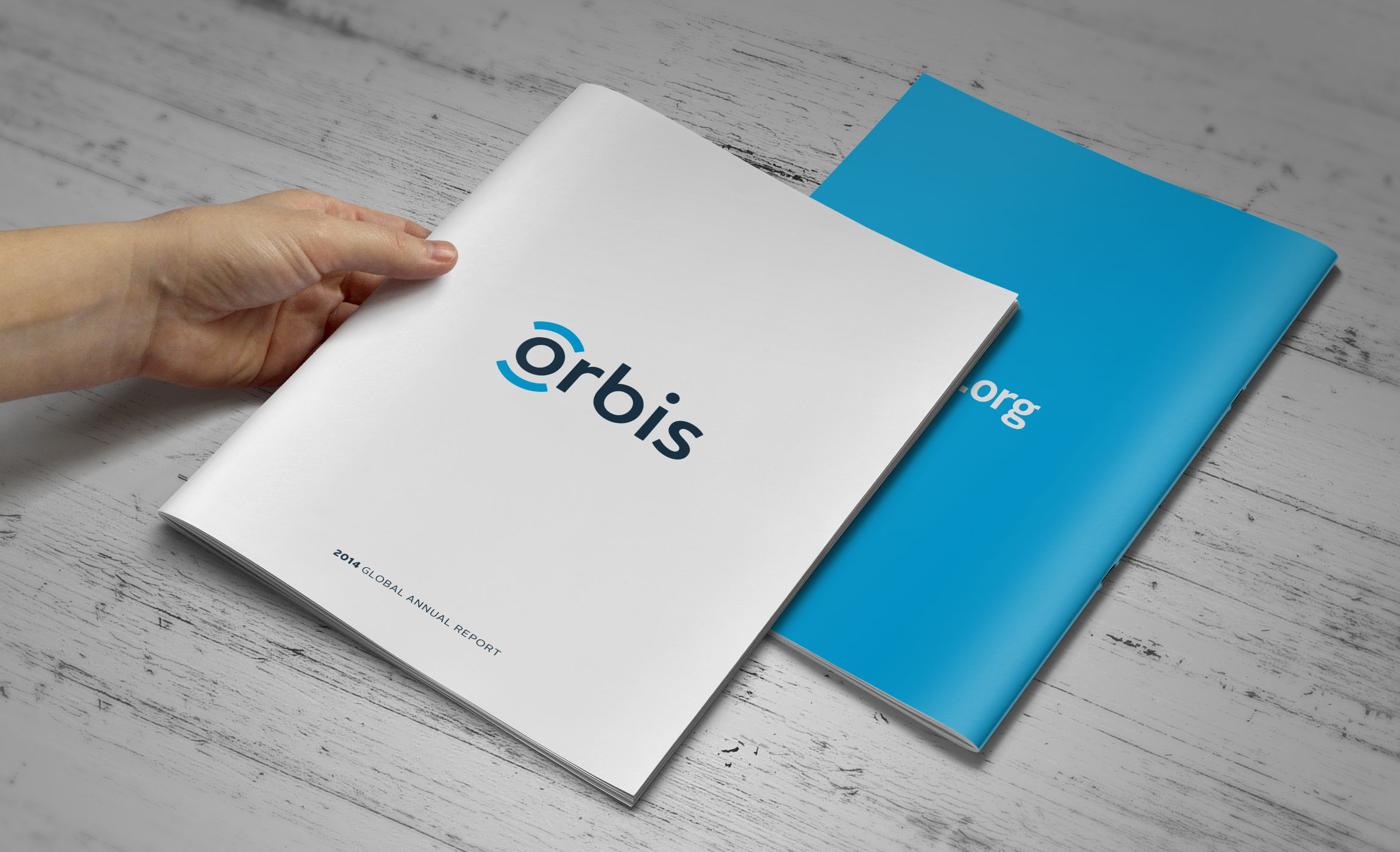 Hand holding Orbis Annual Report