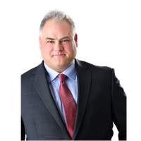 Bill Jacqmein, Founder and CEO of Prime Path Medtech, in a professional headshot wearing a suit and tie.
