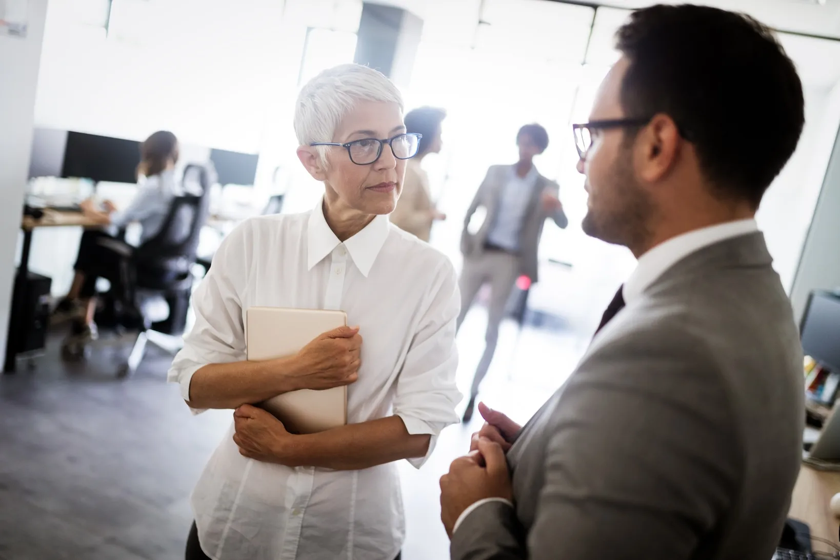 coworkers speaking in an office