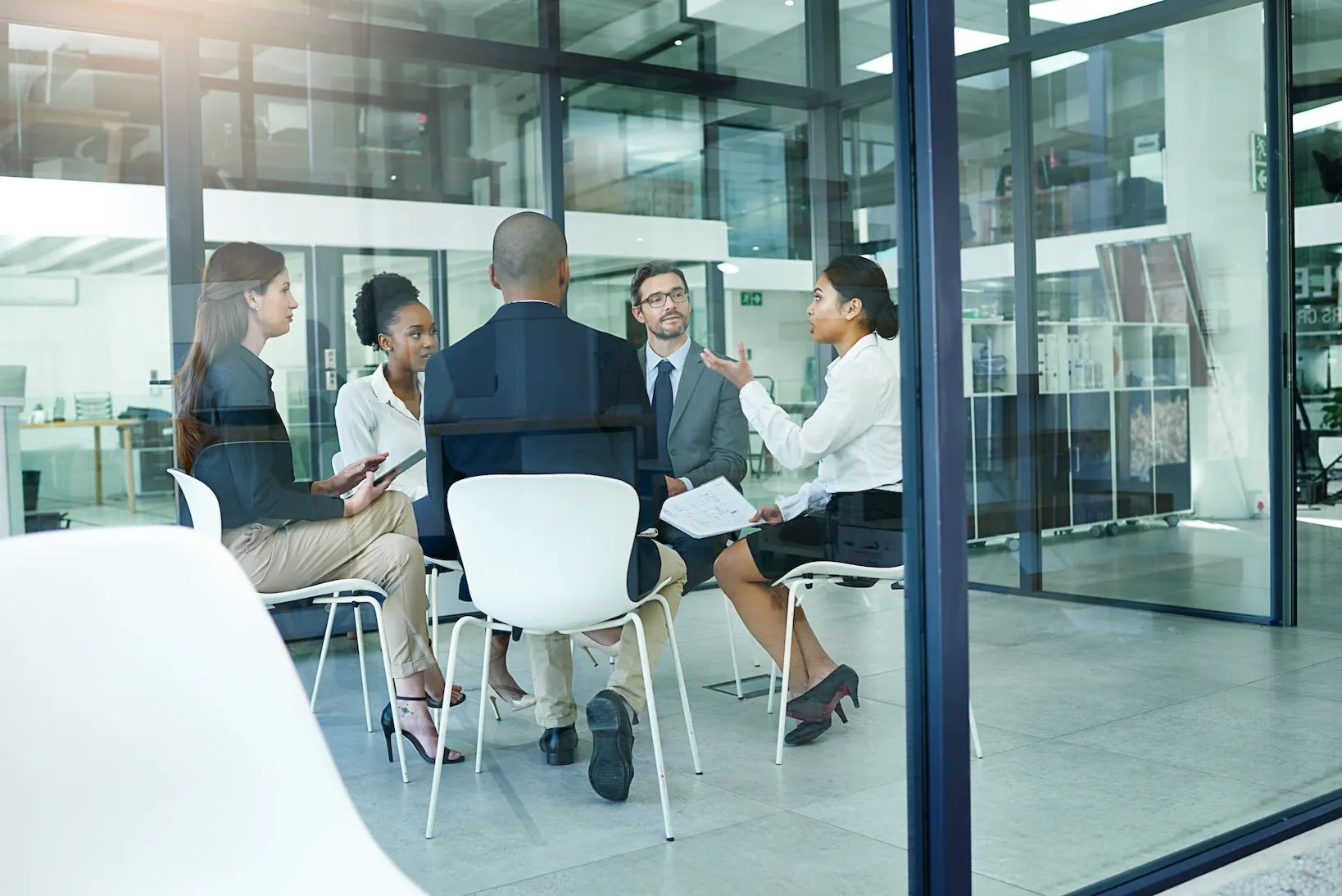 staff meeting in a glass office