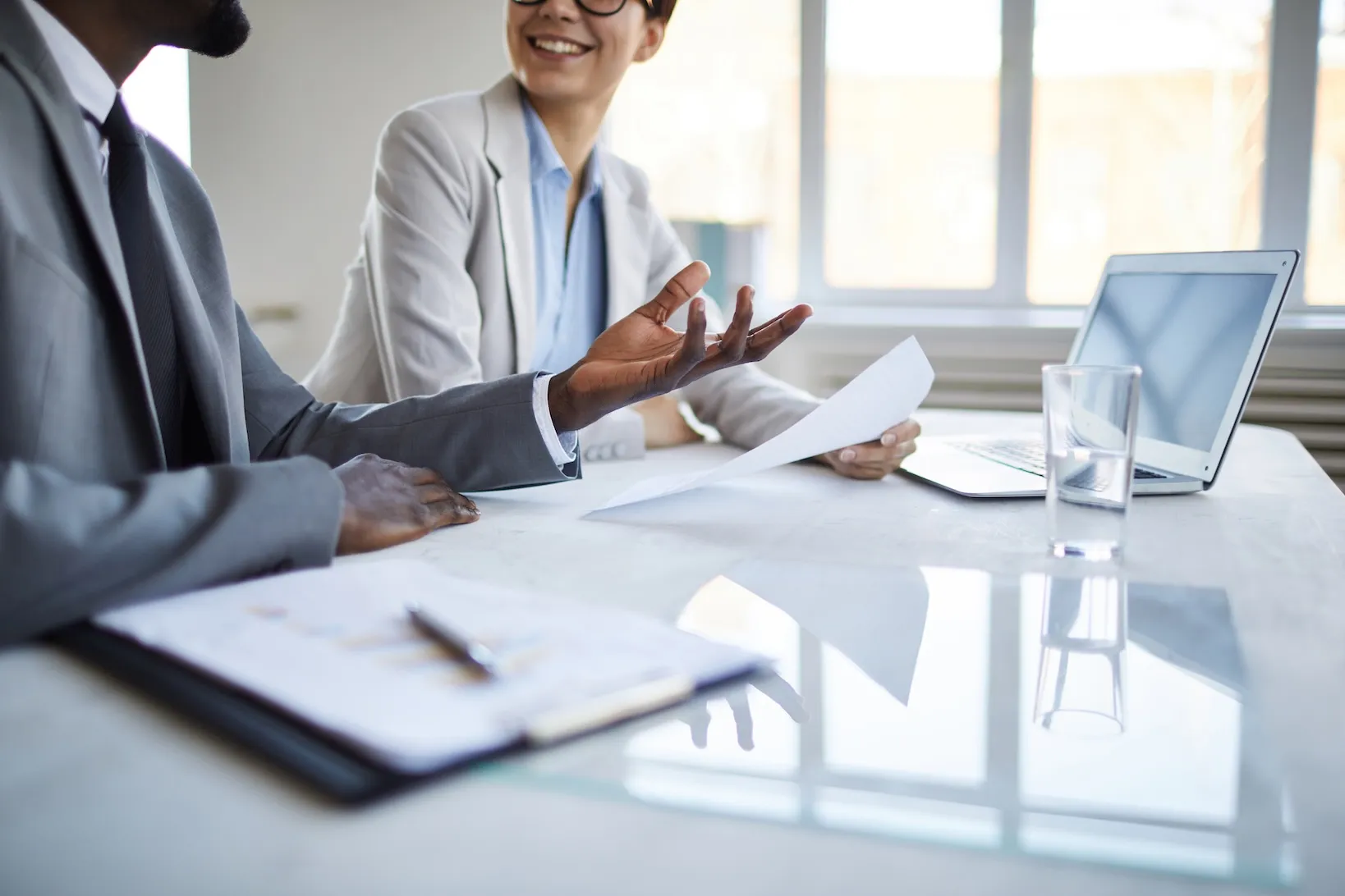 coworkers talking at a table