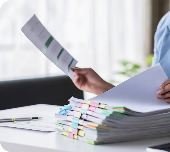 a person organizing papers