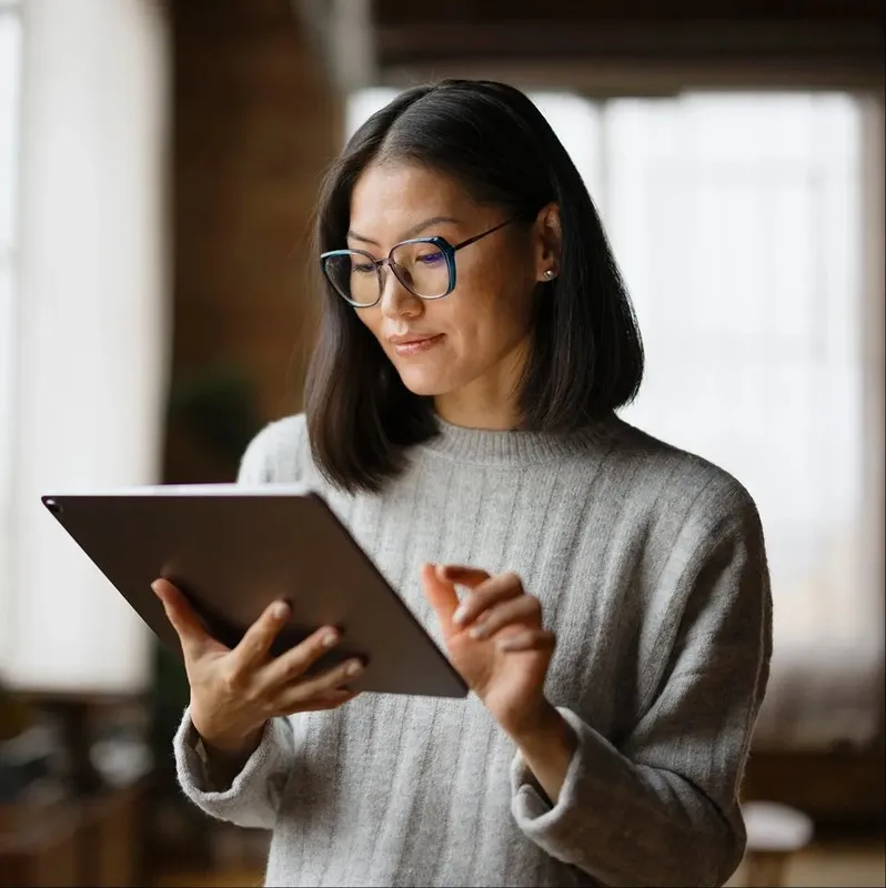 Professional reviewing customer account information on a tablet