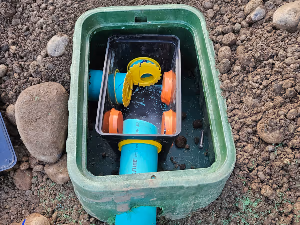 Septic drain routing system.