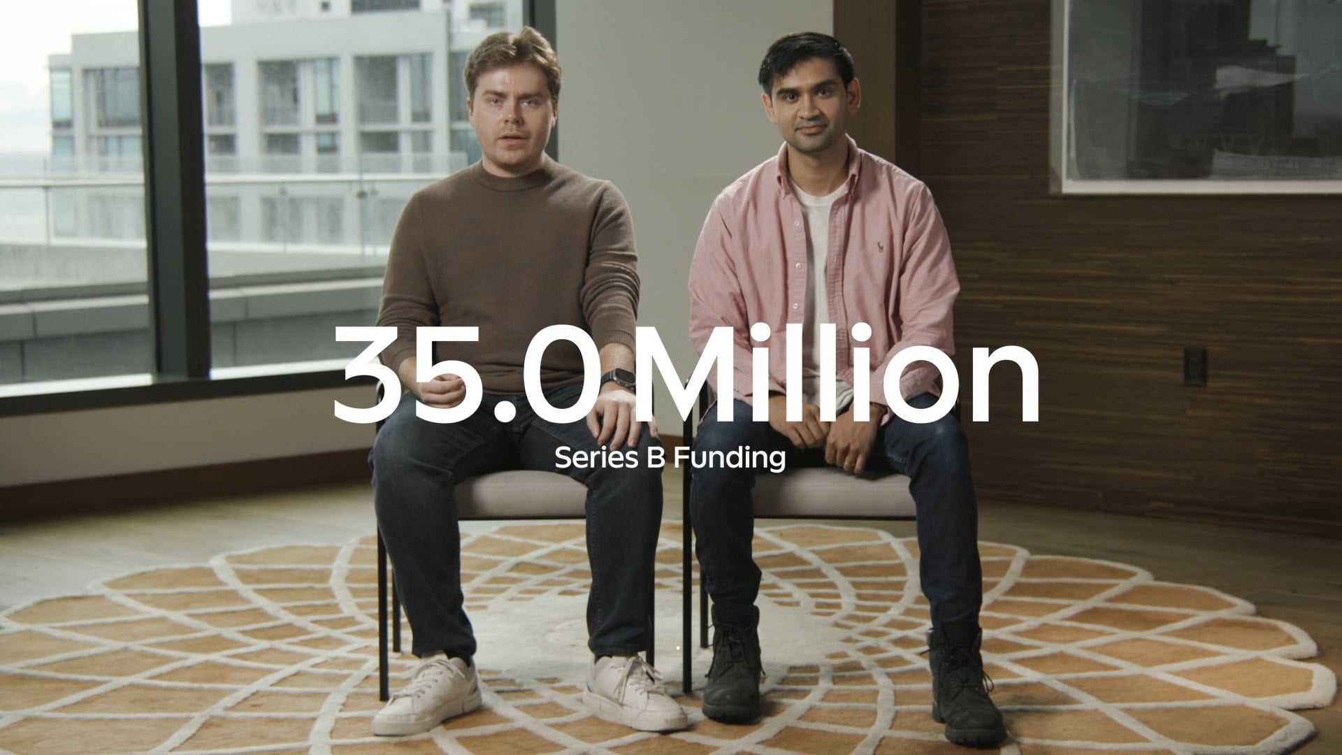 Two men sitting in modern office with "35.0 Million Series B Funding" text overlay
