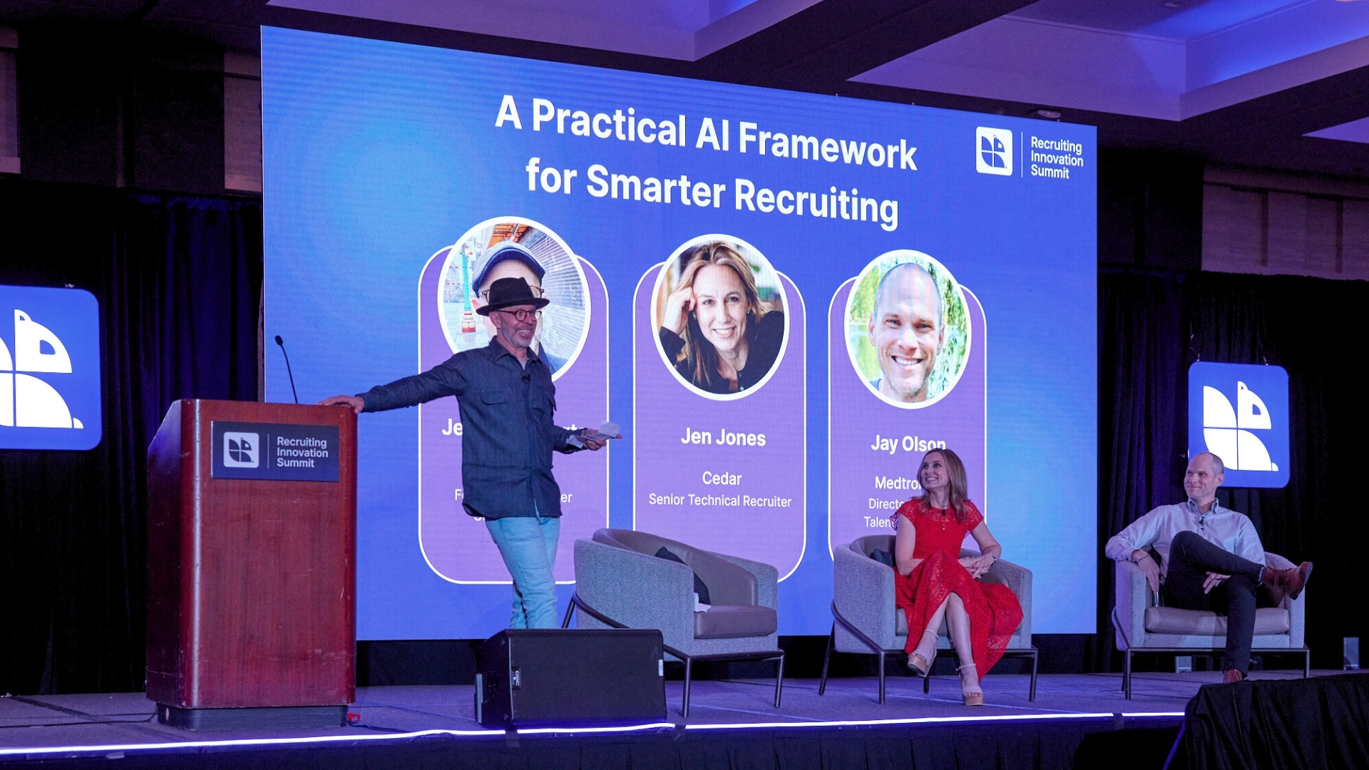 Presenter speaking at Recruiting Innovation Summit about AI framework for smarter recruiting with panel members