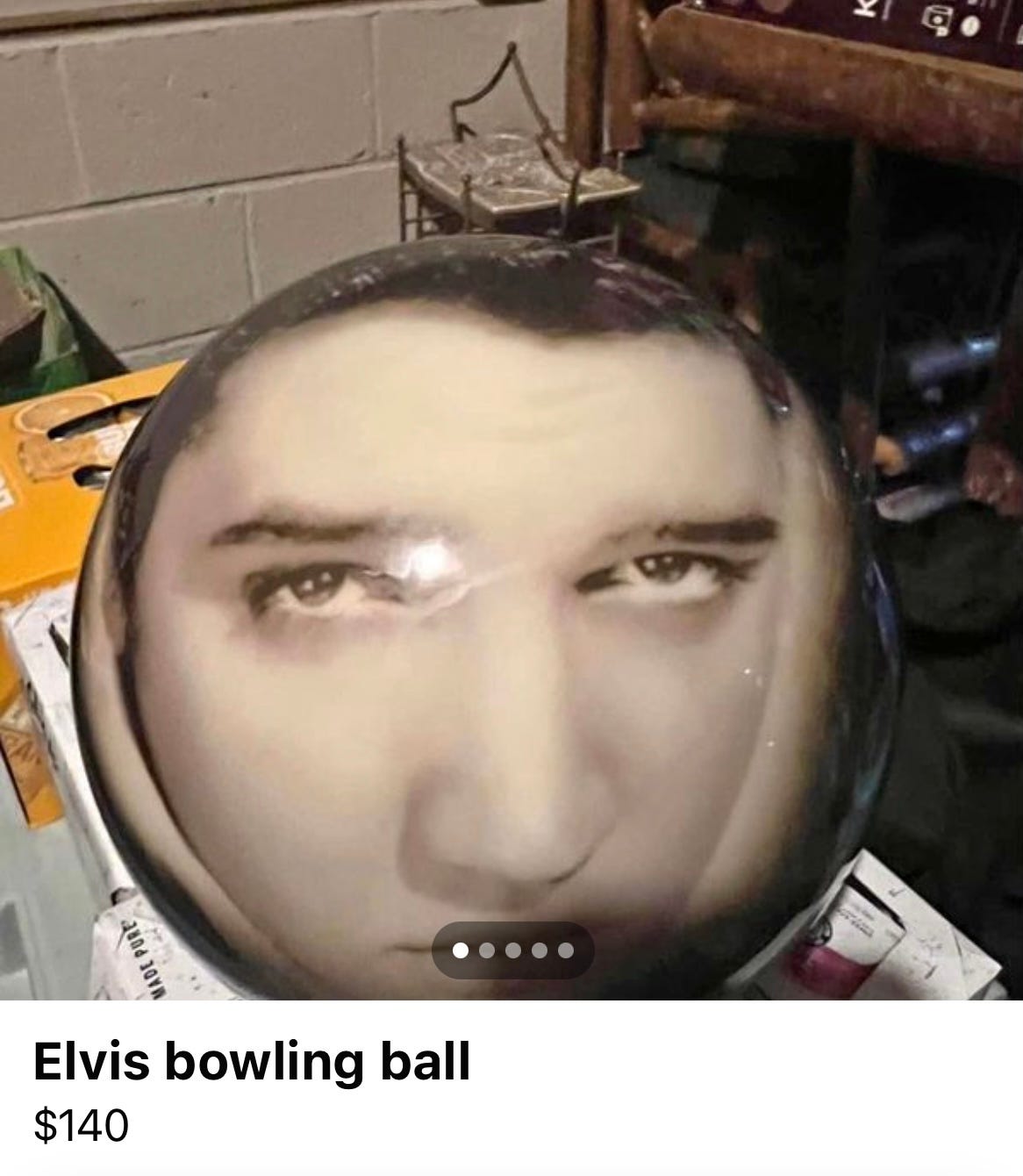 a bowling ball featuring an extremely distorted photo of elvis's face.