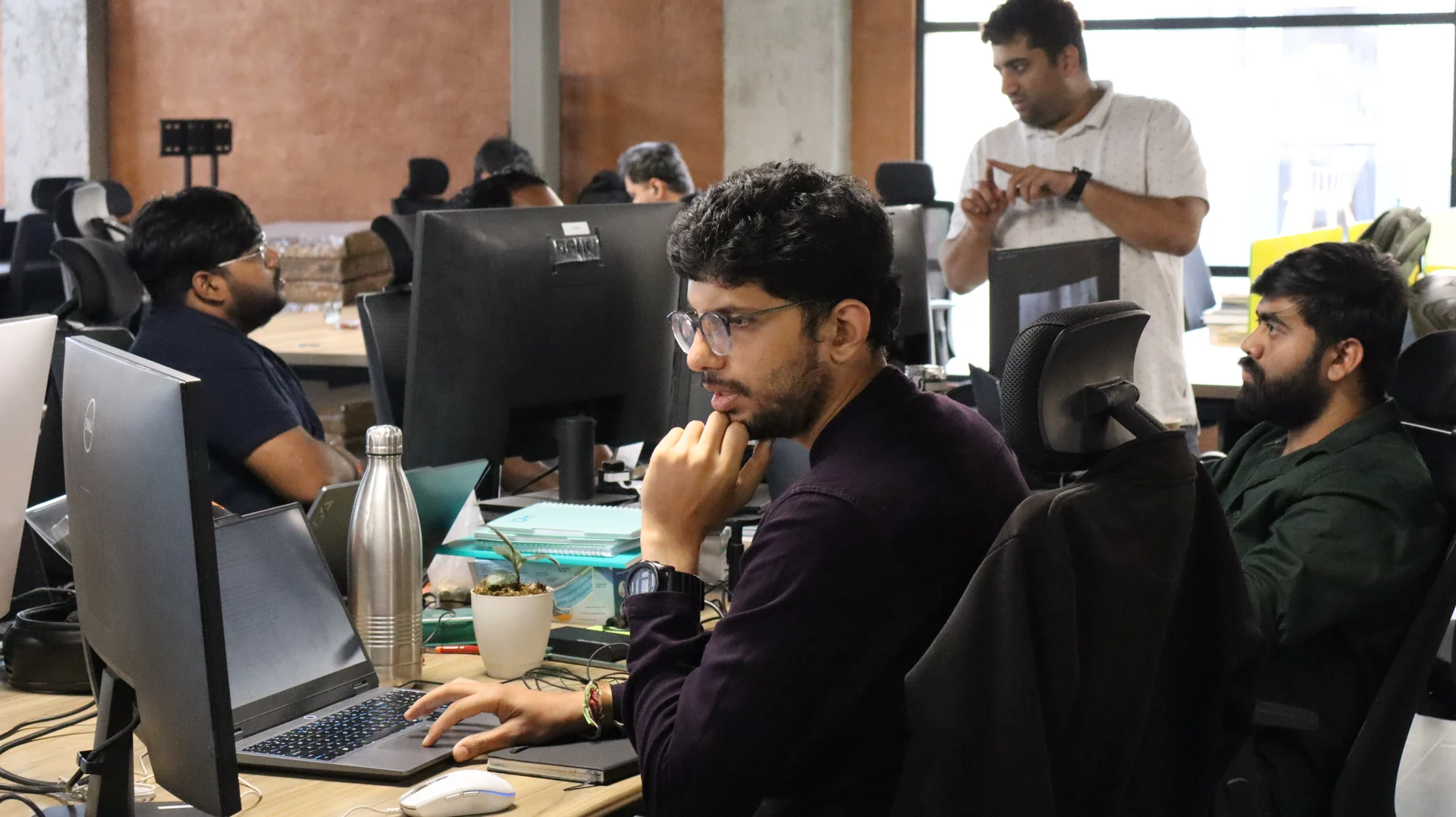 The team working at their desks