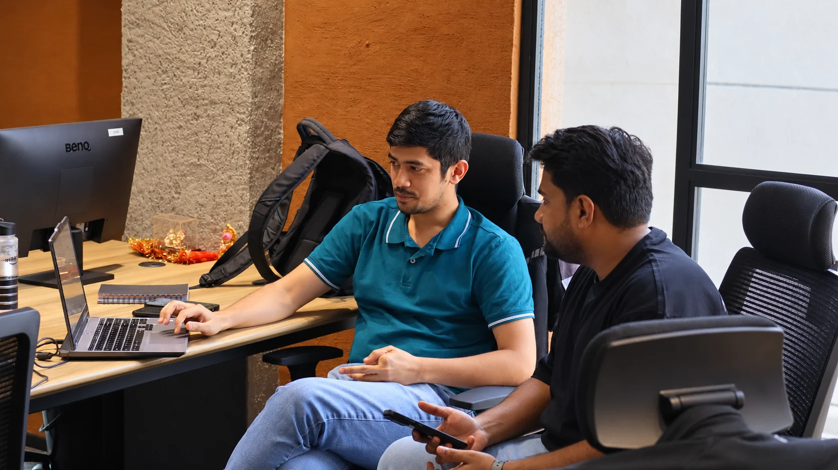 Teammates reviewing work together