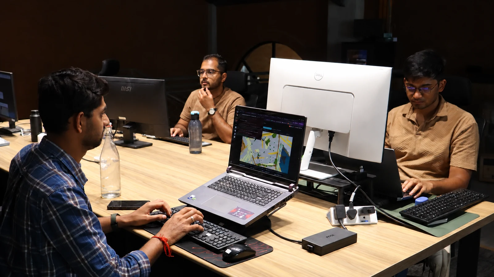 Origin engineers reviewing robot perception and software