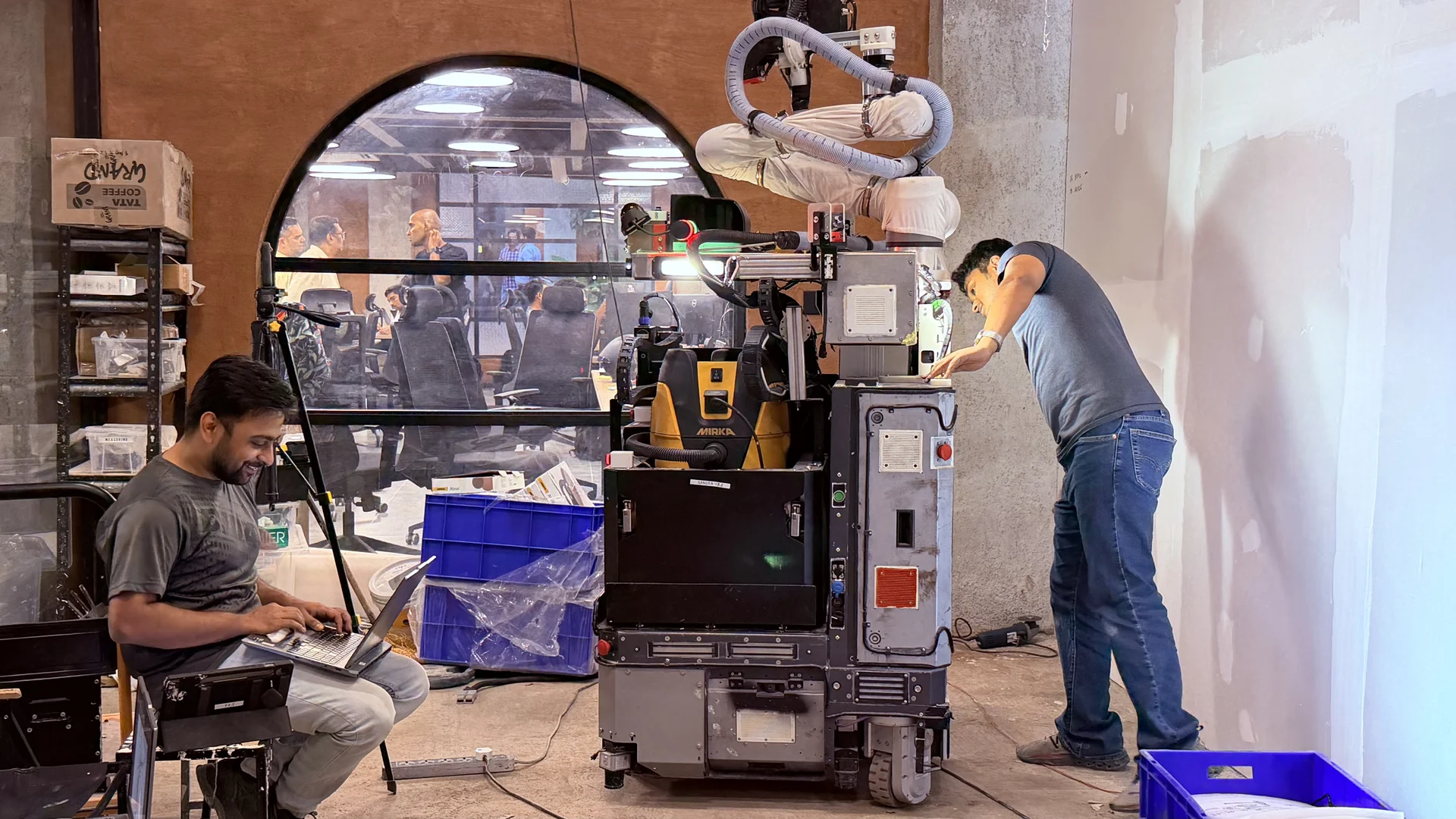 Engineers working with the robot in the workshop