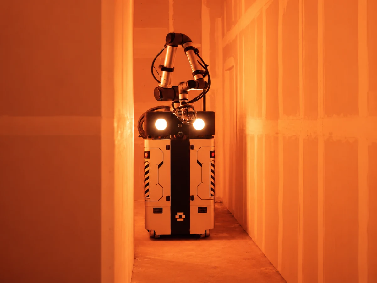 OG-1 in an orange-lit room