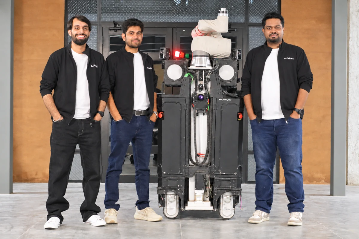 Origin founders standing alongside OG-1