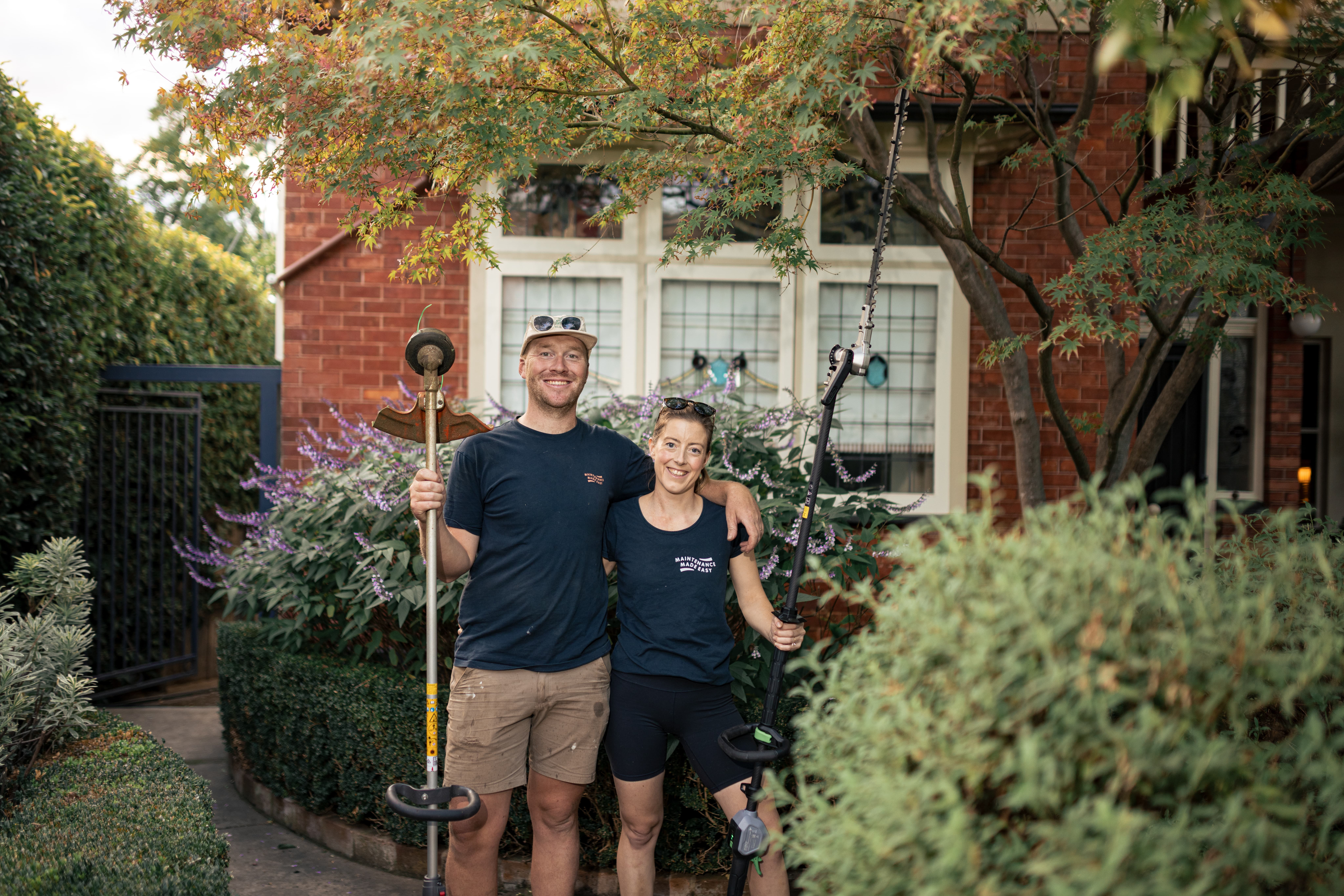 Oscar and Edi from Home n Hosed standing outside a residential property after completing outdoor maintenance work