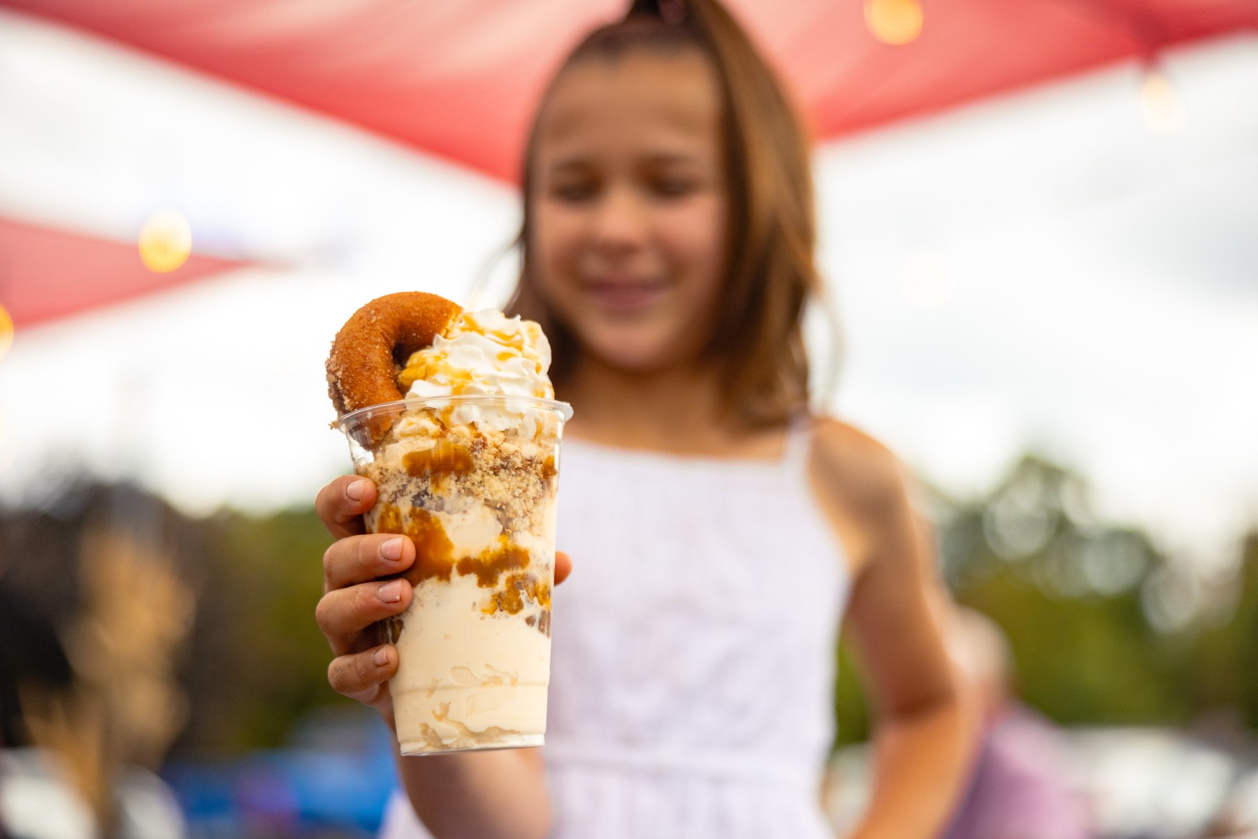 Child holding an ice cream from Bishop's Creamery