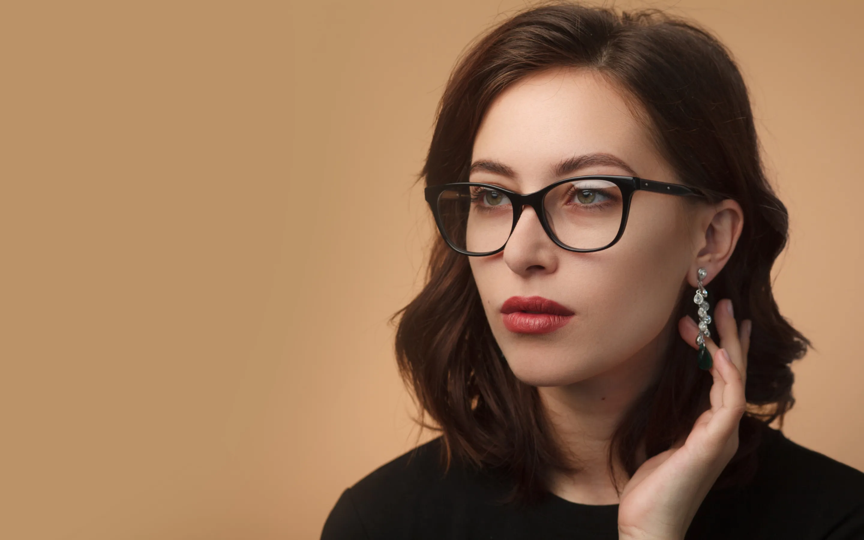 Woman wearing elegant black prescription glasses showing modern eyewear style options