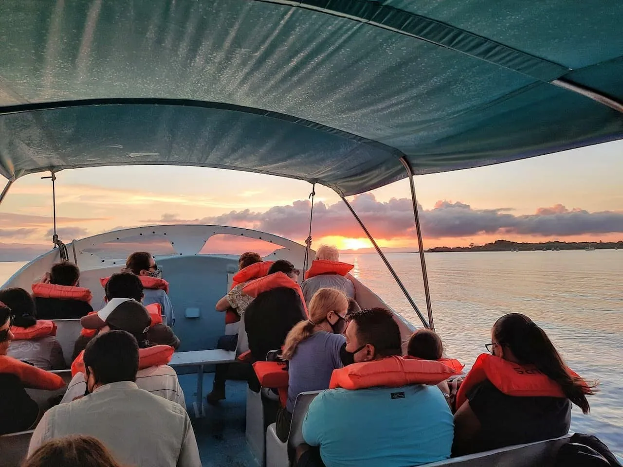 Group of people on a boat at sunset (Boat ride to Sirena)