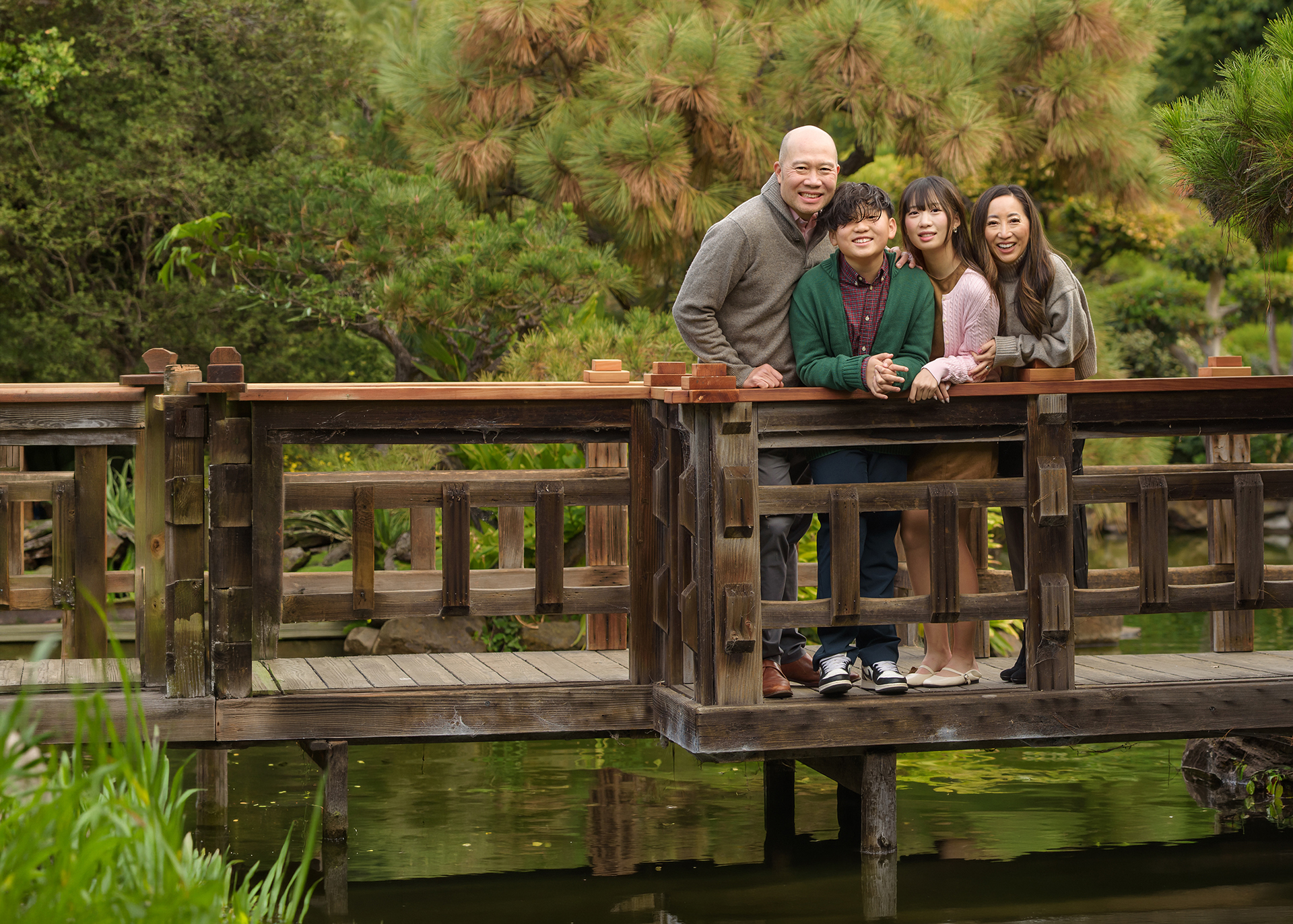 A lovely family of 4, including Dr. Shiao, Dr. Liao and their two teenaged children: a boy and a girl.