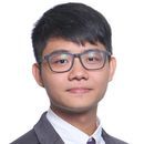 Portrait of a young Asian man with black hair and glasses wearing a dark suit, white shirt, and tie against a white background.