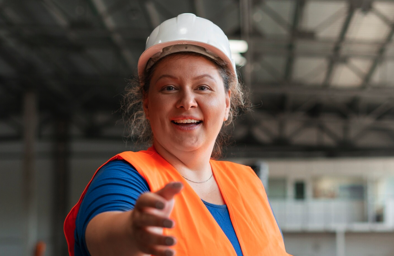 Smiling worker in a hard hat and high-visibility vest, illustrating Australian work health and safety statistics