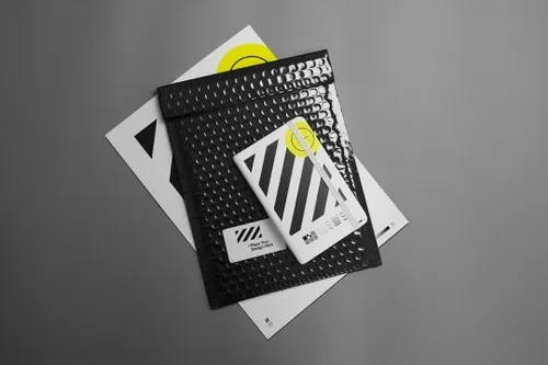 Triple mockup containing paper mockup, bubble envelope mockup and notebook mockup