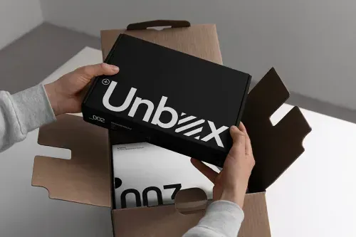 Packaging mockup containing 2 highly editable cardboard boxes. Customer unboxing a product in studio setting