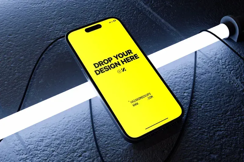 Animated After Effects mockup featuring a iPhone highlighted by a striking neon light. With its raw feeling, textured background, this mockup offers an attention grabbing video. Customize the color of the neon light to perfectly match your brand or project aesthetic, ensuring your design stands out in any portfolio or presentation.