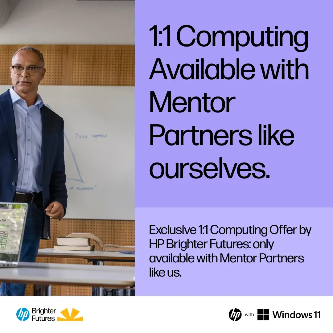 Man in glasses and blazer standing in classroom next to text about 1:1 computing with mentor partners.
