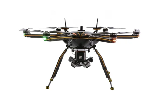 Black hexacopter drone with camera and green and red lights on arms against white background.