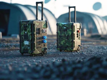 Two camouflage-patterned rugged mobile power stations