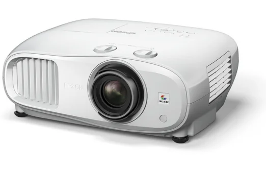 White Epson 3LCD projector angled to show lens, vents, and top control buttons.