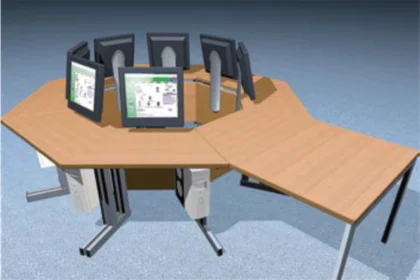 Octagonal wooden desk setup with seven computer monitors arranged for multiple users.