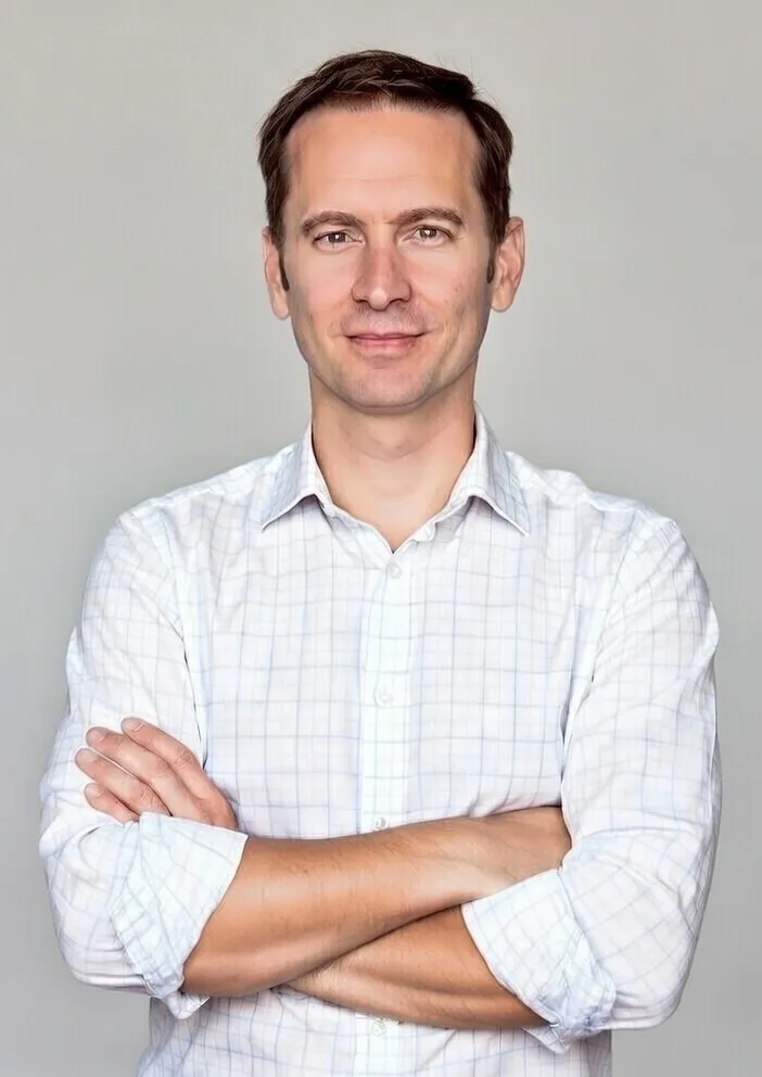 SCB headshot in white ls shirt grey bgrd