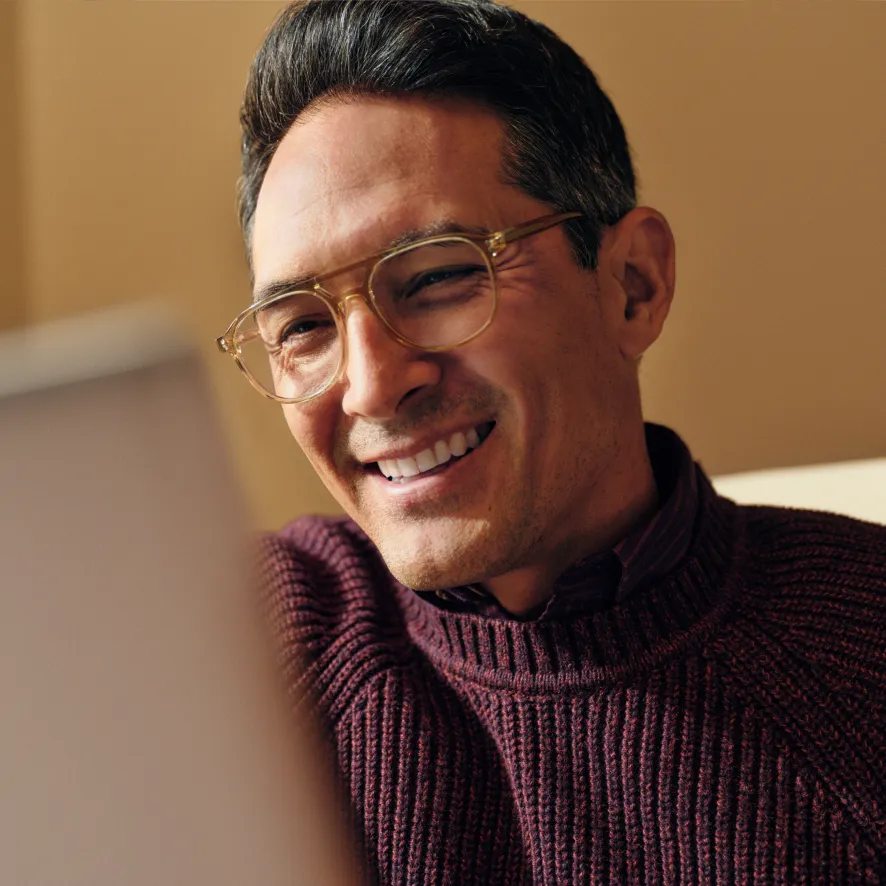 man in glasses smiling