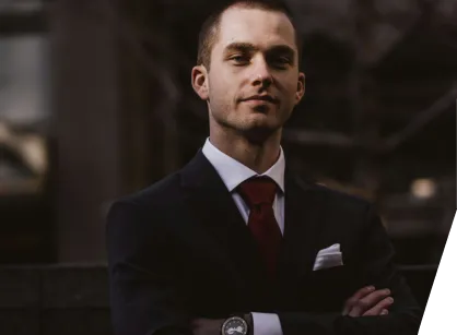 a man in a suit and tie posing for a picture