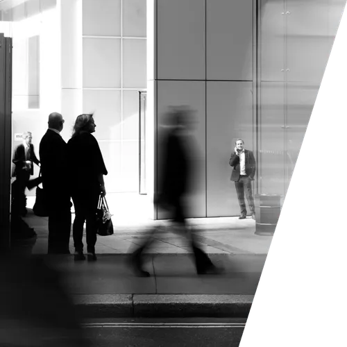 a group of people standing outside of a building