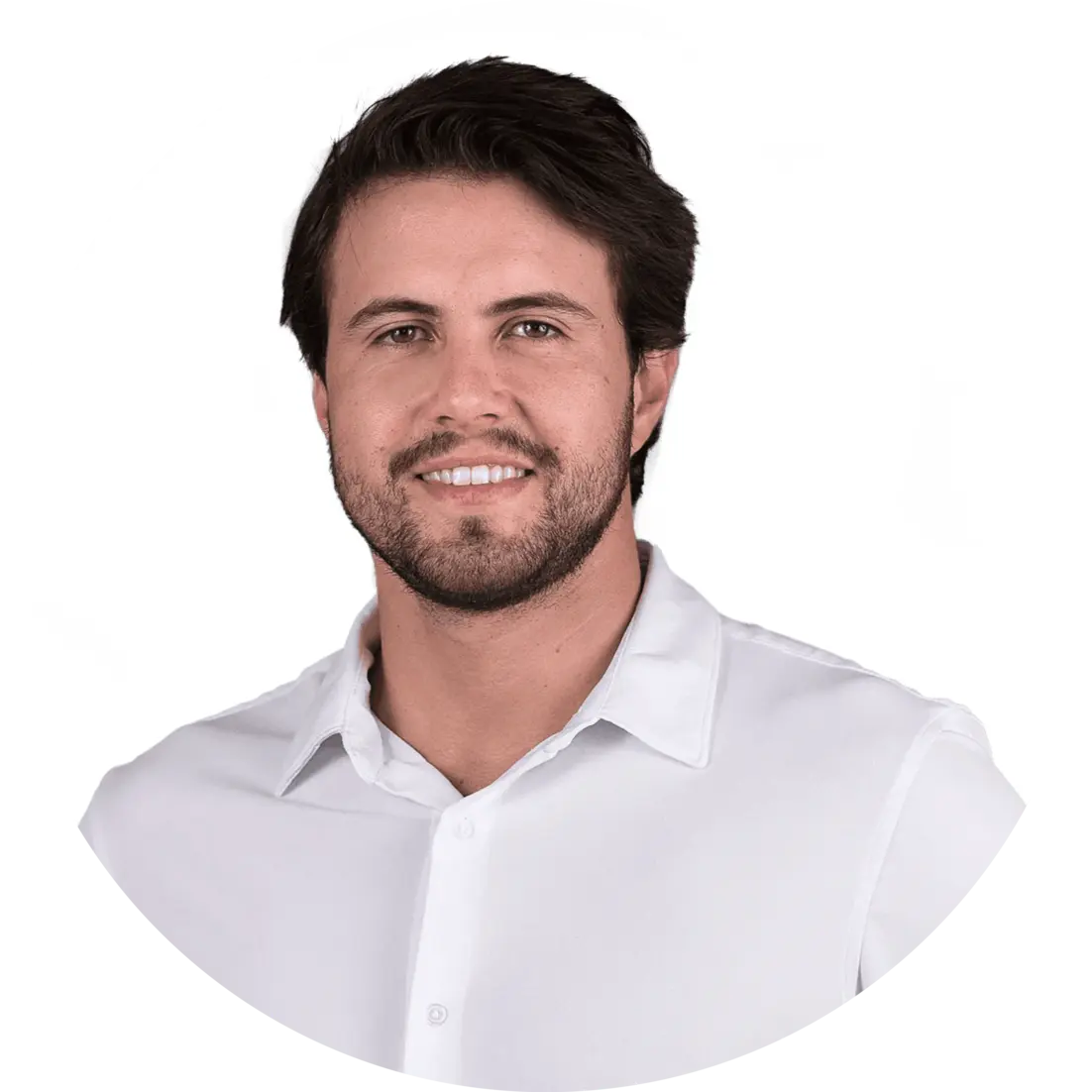 Smiling man with dark hair and beard wearing a white button-up shirt against a white background.