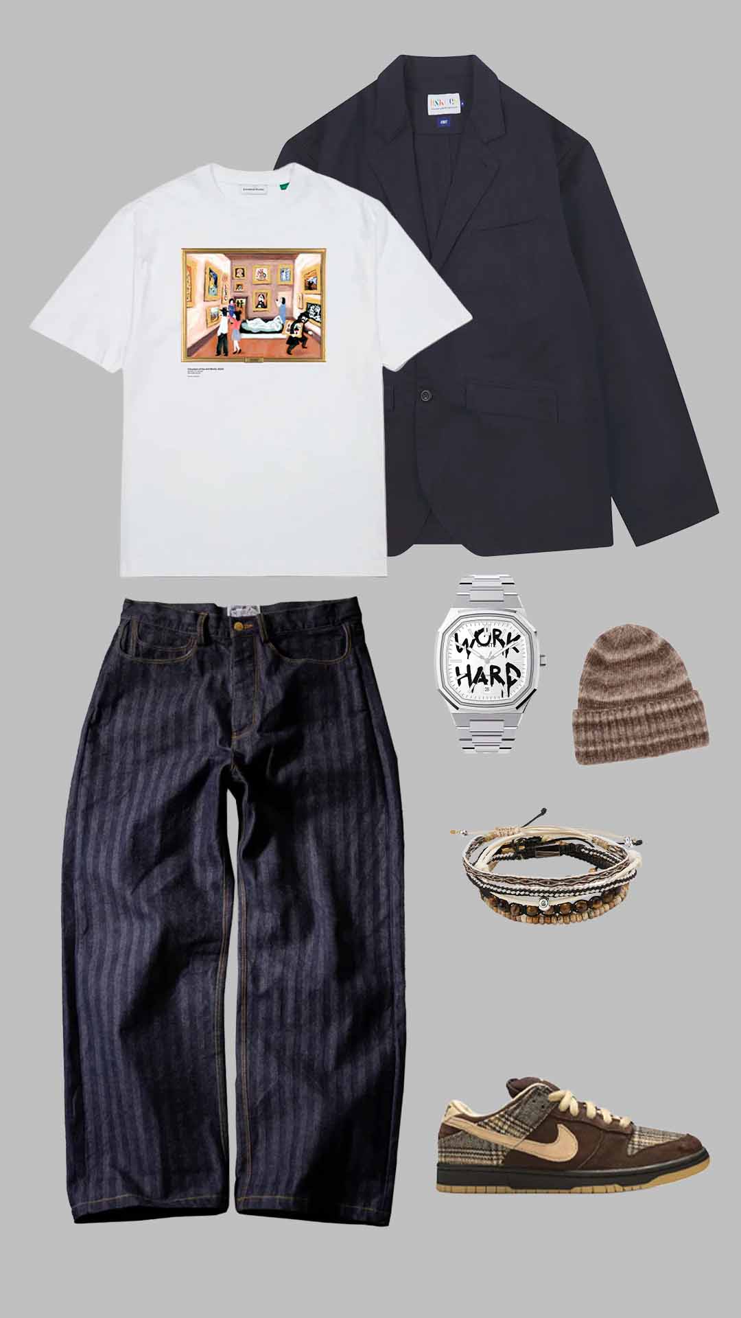 White graphic T-shirt with navy blazer, striped dark jeans, brown beanie, Nike sneakers, and layered bracelets outfit