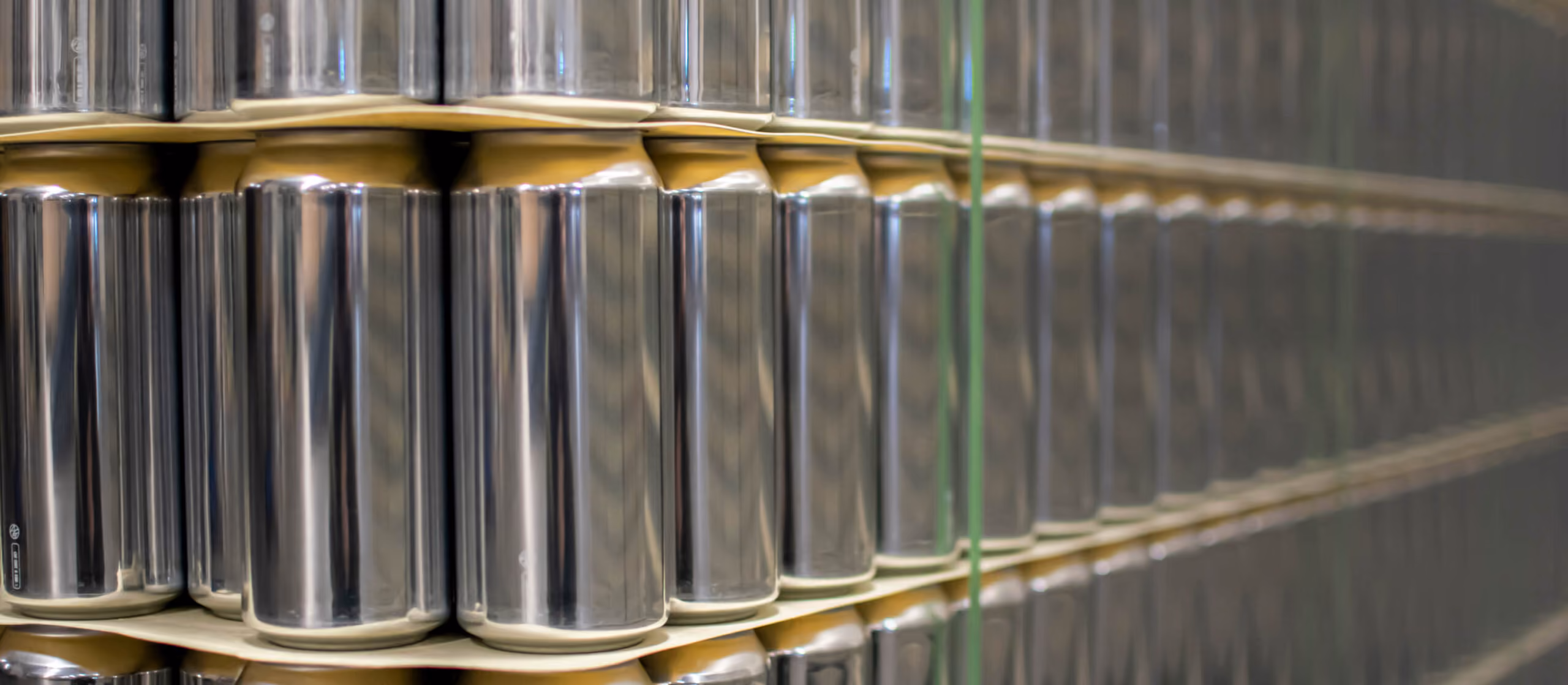 Pallet of cans waiting to be labeled