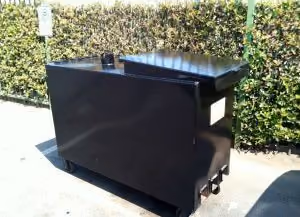 Used cooking oil bin in parking lot