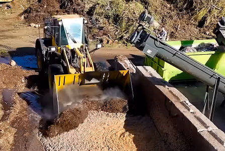 Tractor picking up dirt