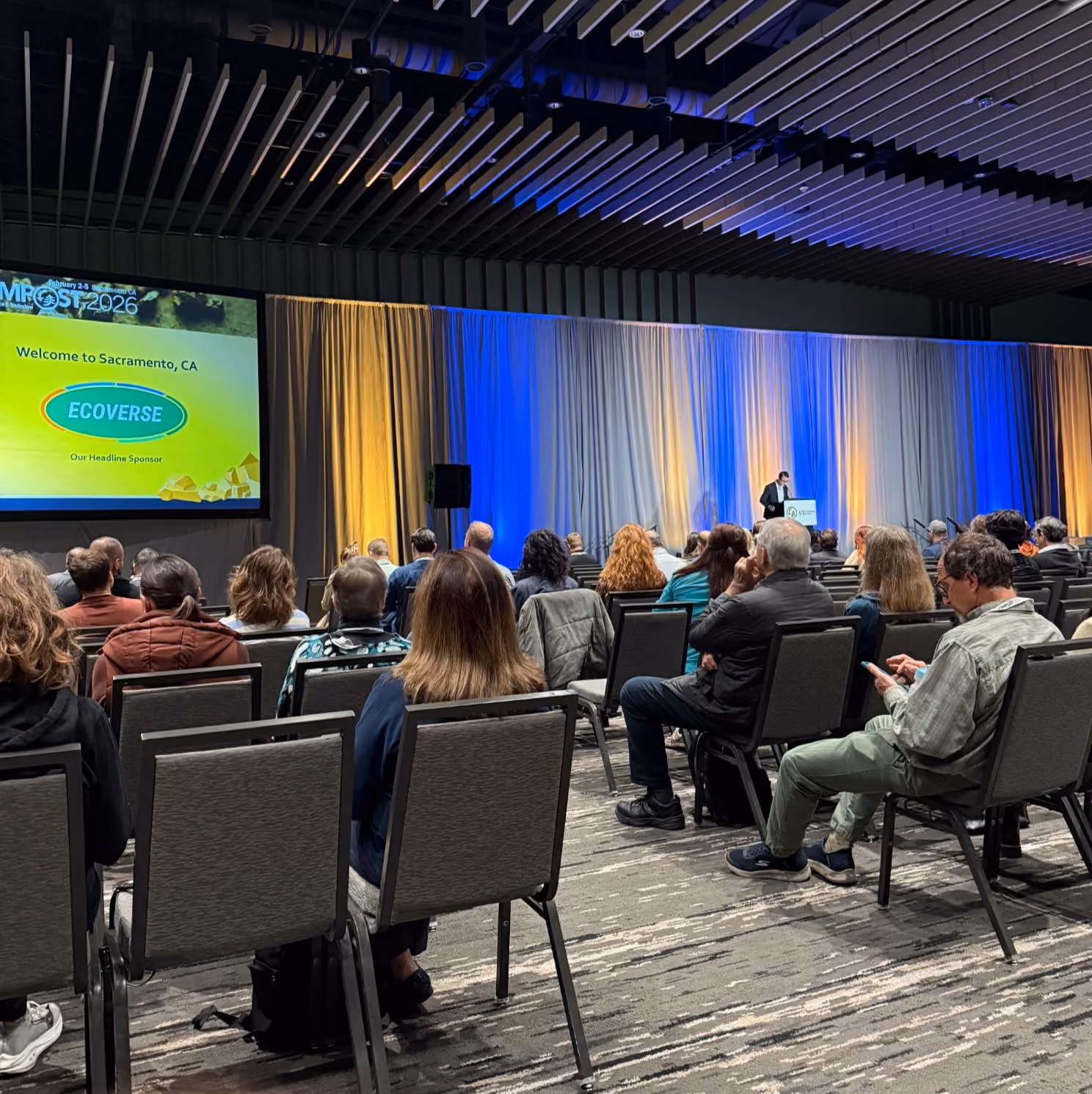 Audience listening to an educational session at COMPOST 2026.