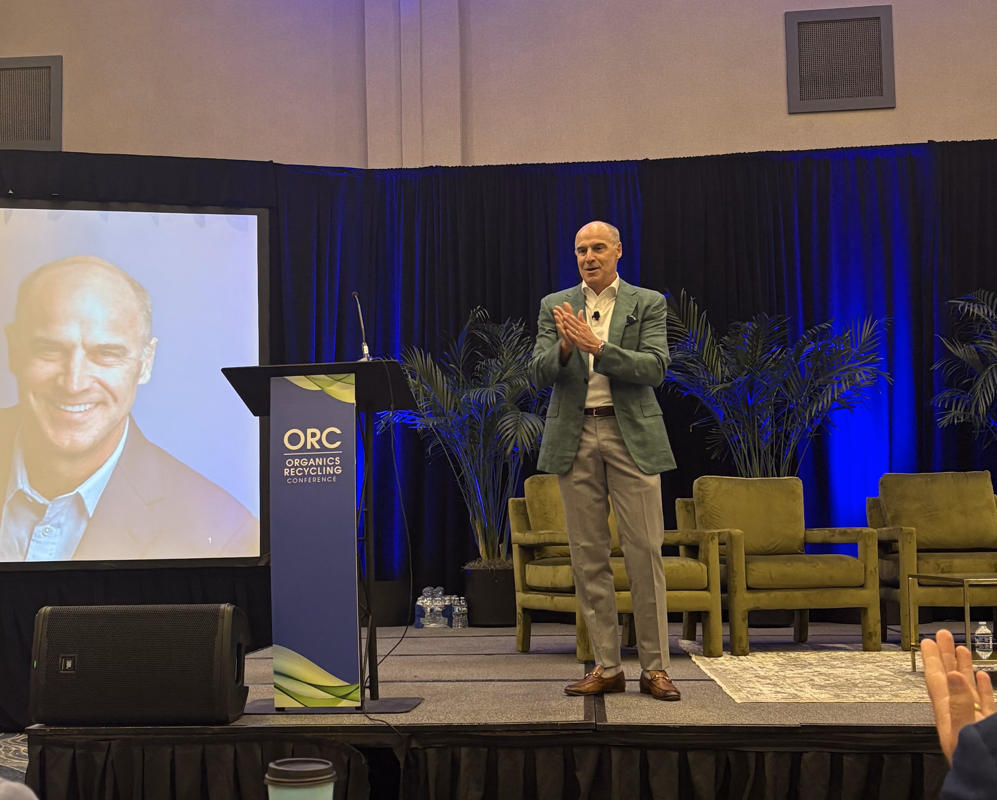  Denali Founder & Chairman Andy McNeill giving a presentation in front of an audience