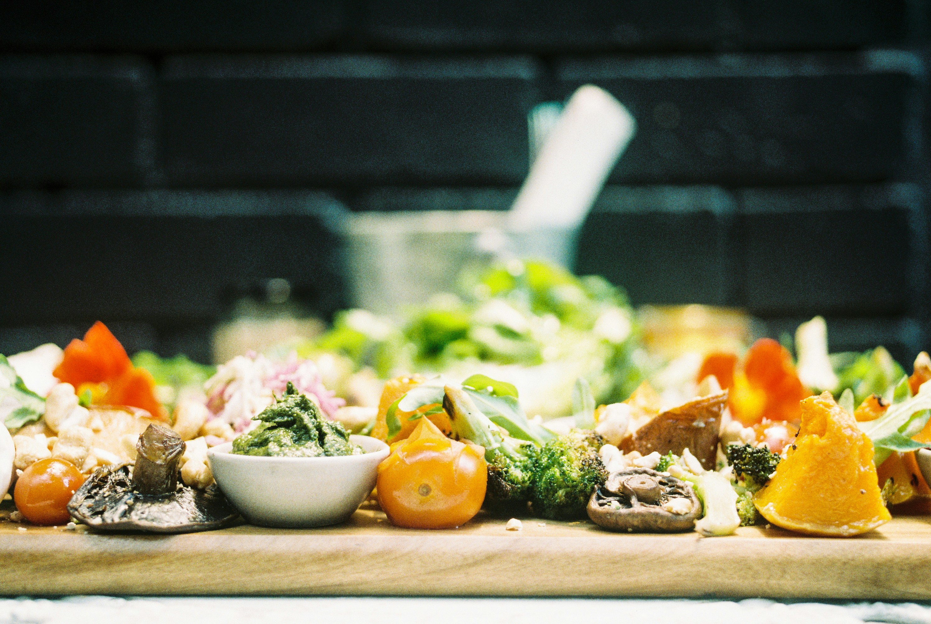 Wooden tray with spent food on it