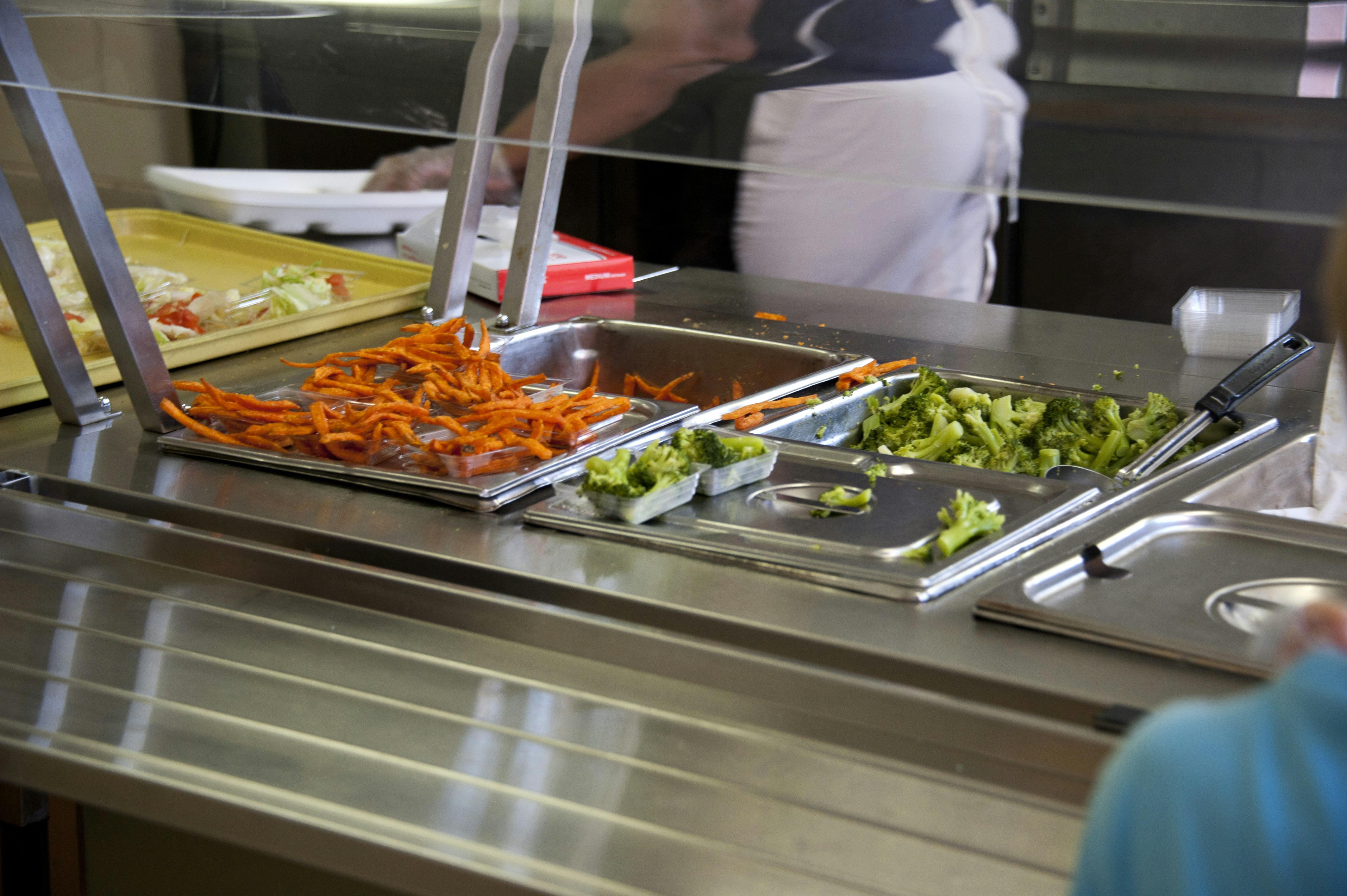 Cafeteria line with brocolli and fries