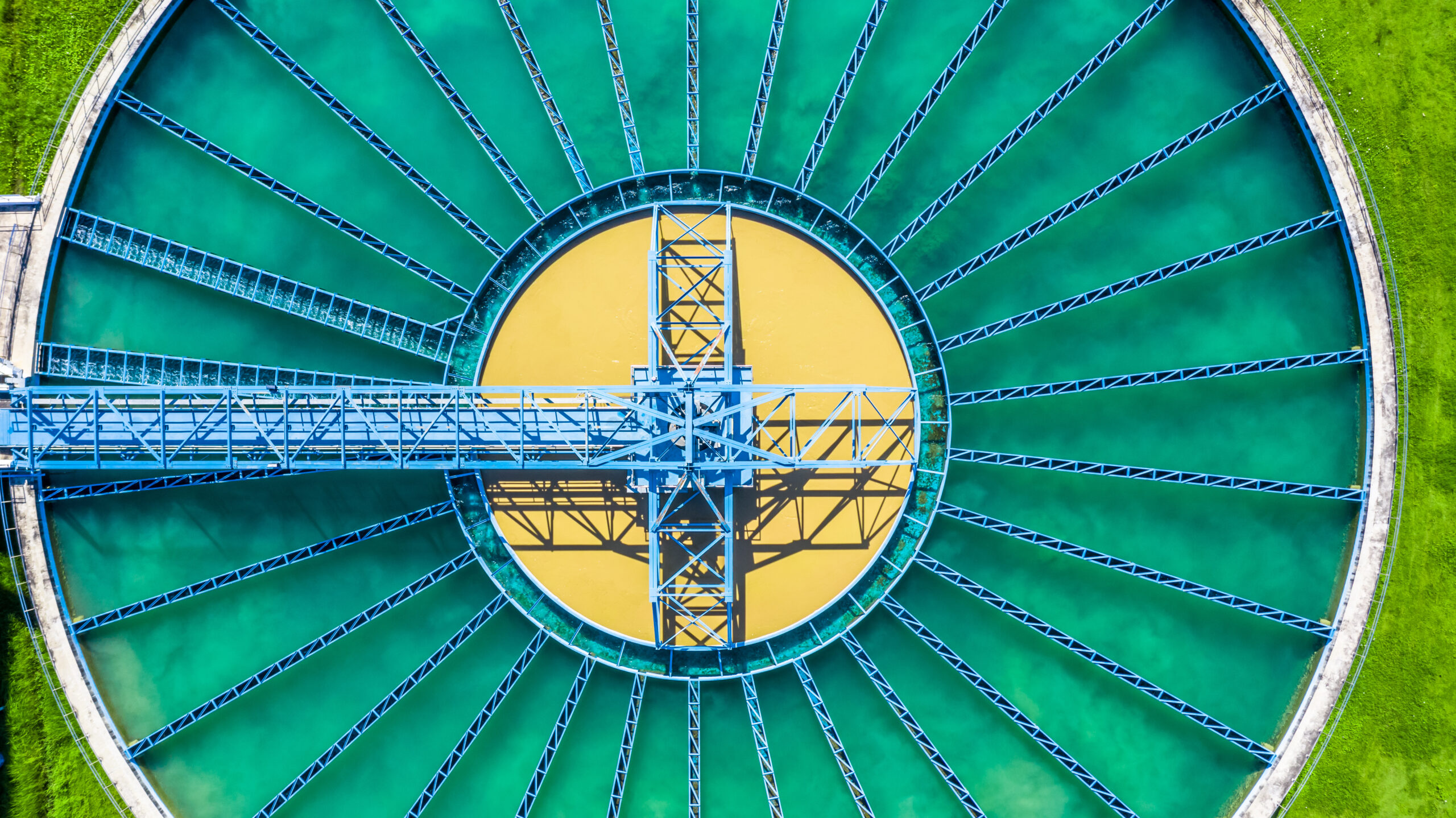 Overhead view of circular clarifier tank at a municipal treatment plant