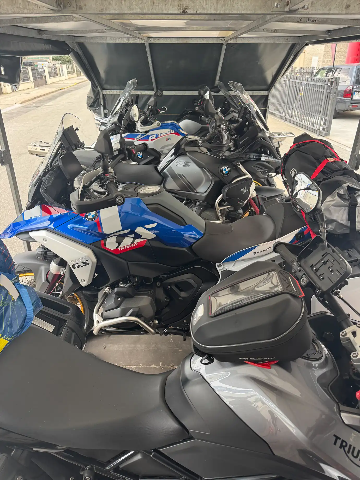 Six motorcycles securely fastened in the trailer.