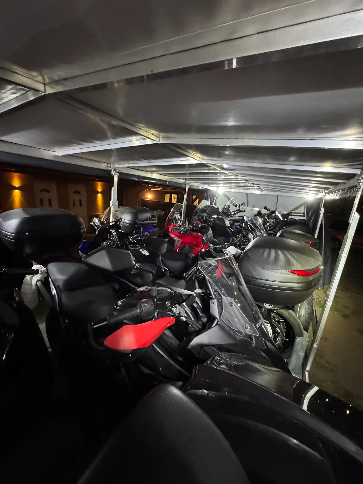 Enclosed trailer full of securely fastened motorcycles.