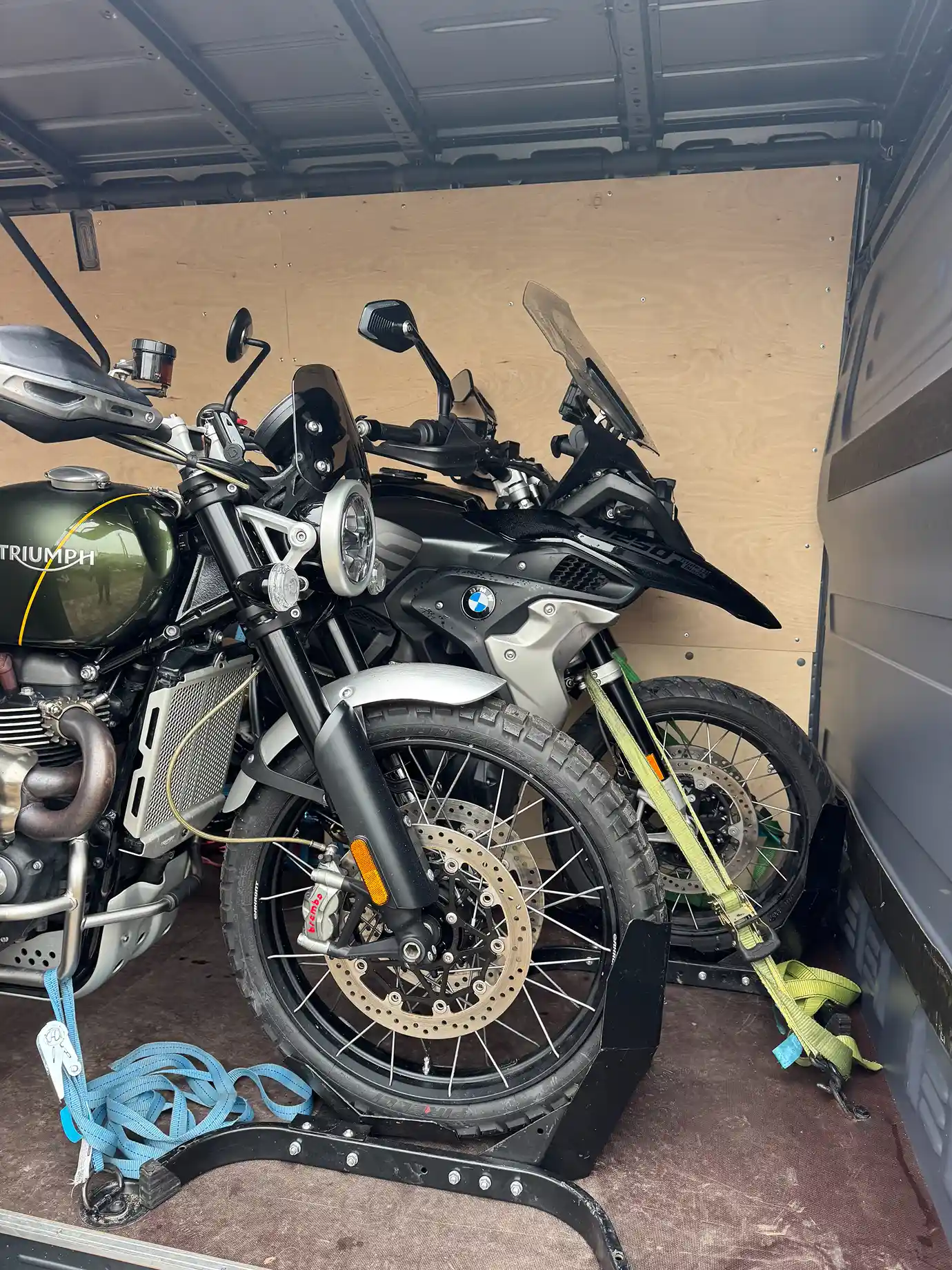 Two motorcycles secured inside the van.